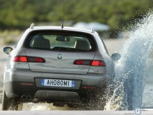 Alfa Romeo Crosswagon Q4 back view water  wallpaper