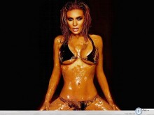 Carmen Electra covered in honey wallpaper